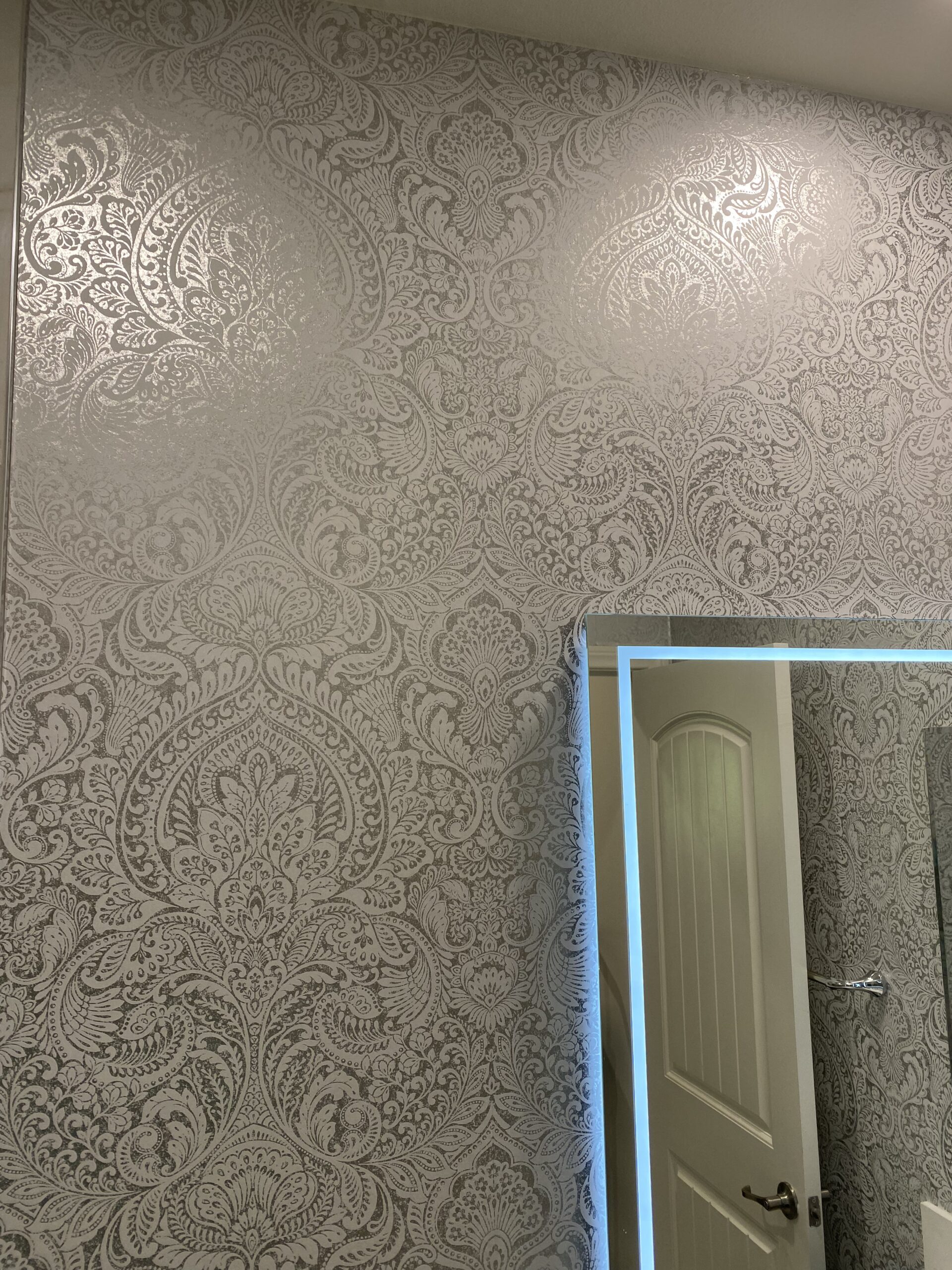 Wallpaper installation in a bathroom