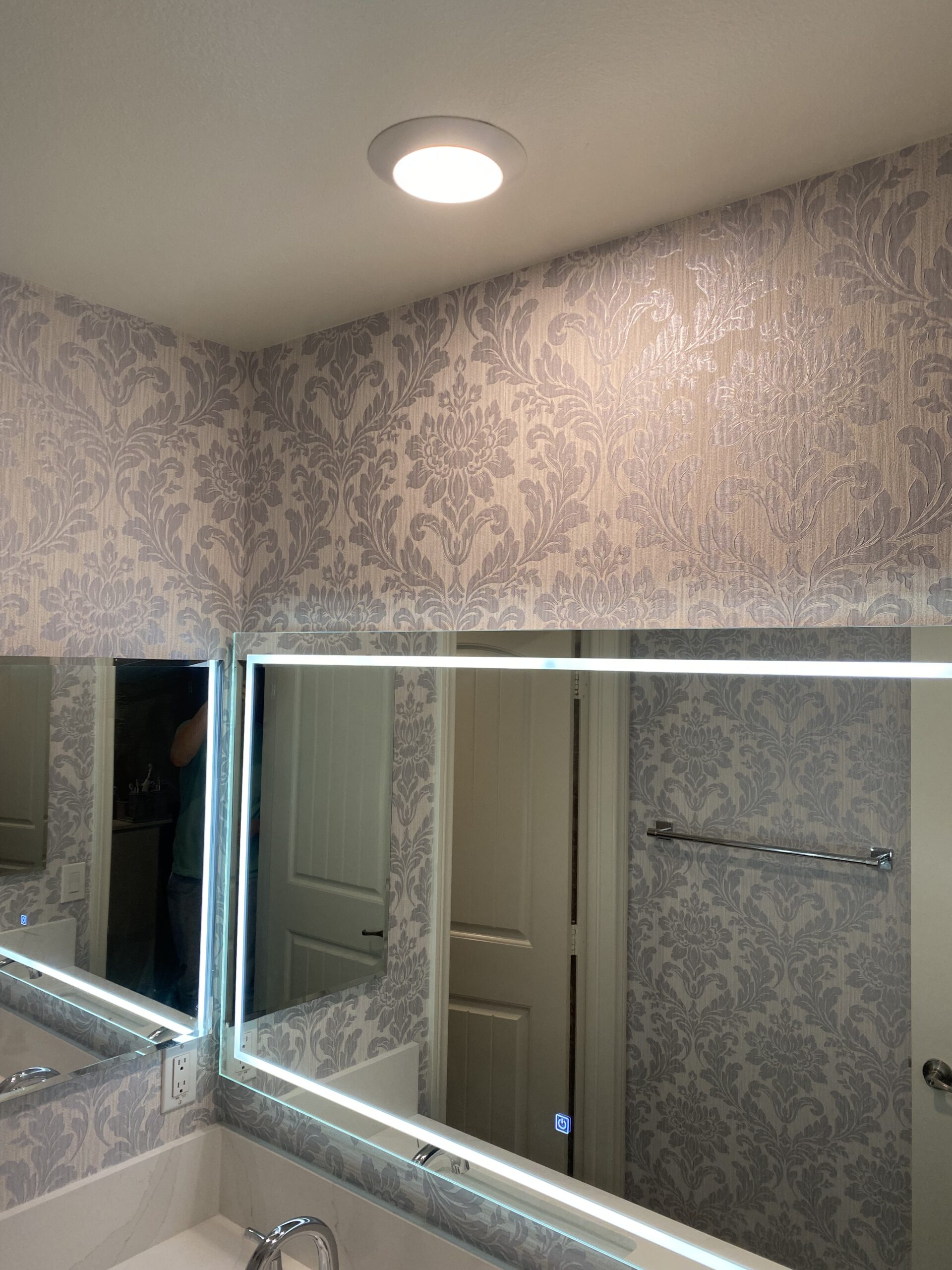 Wallpaper installation in a bathroom