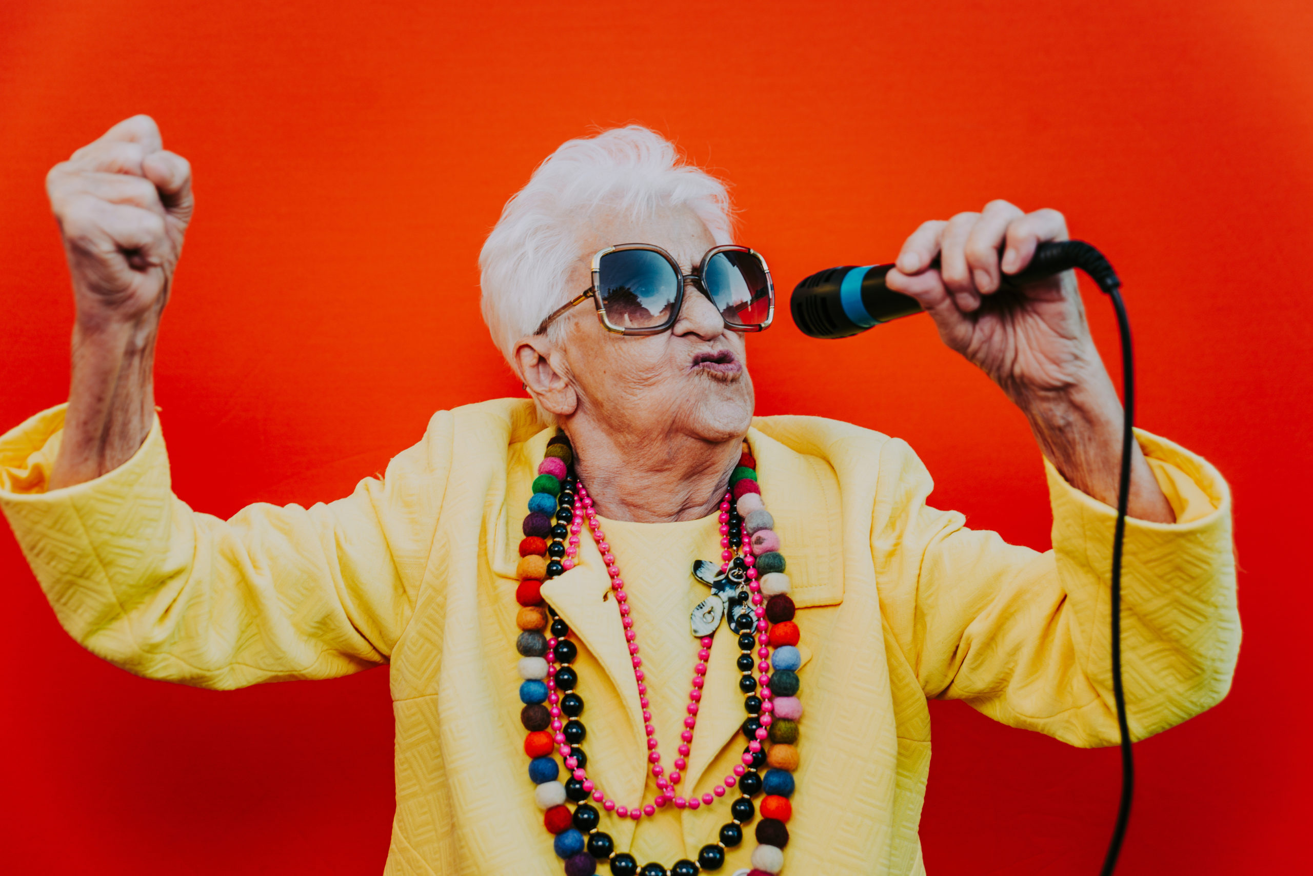 Funny grandmother portraits. Senior old woman dressing elegant for a special event. Rockstar