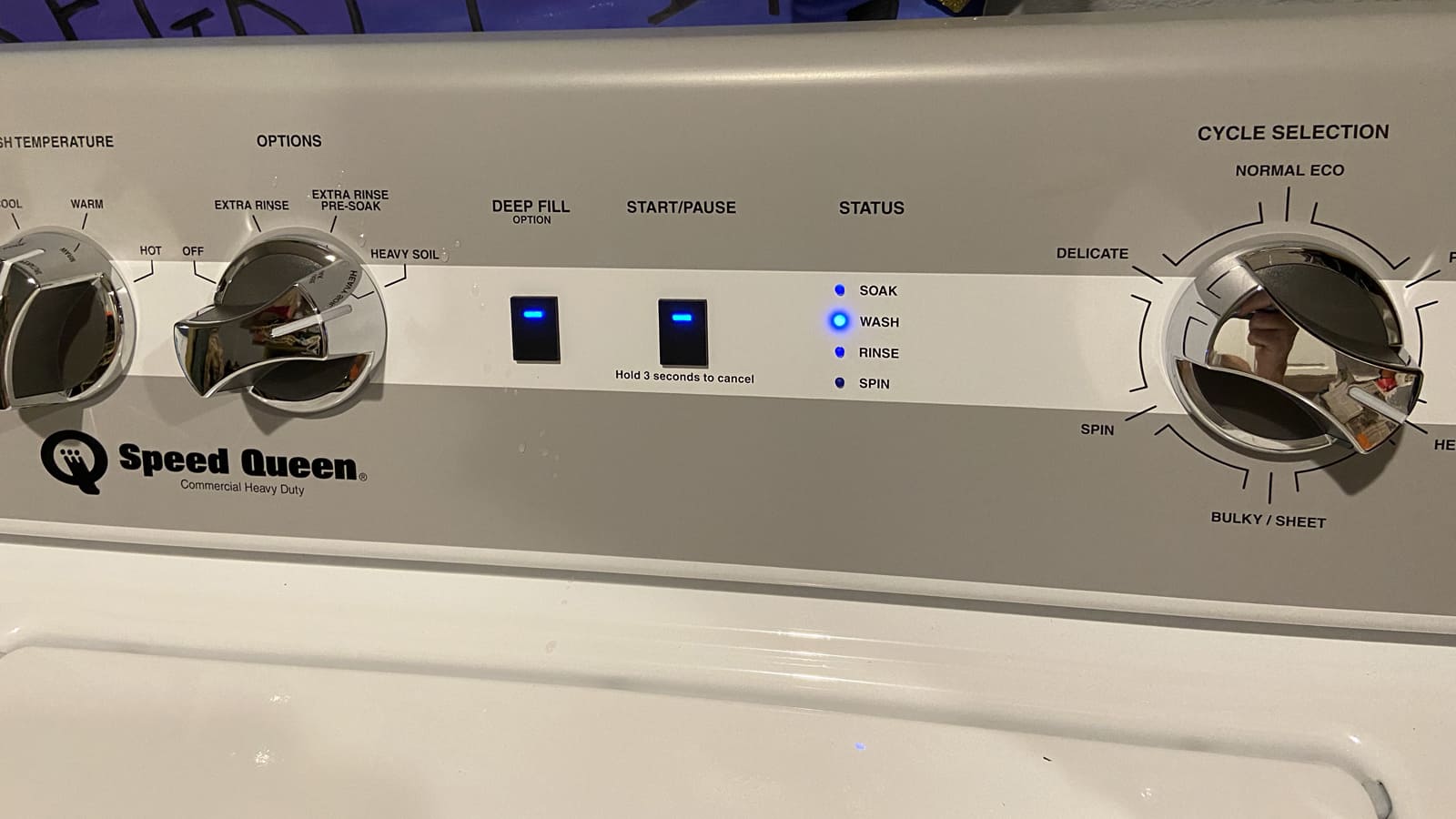 The lights "wash" and "rinse" are flashing on the Speed Queen washer