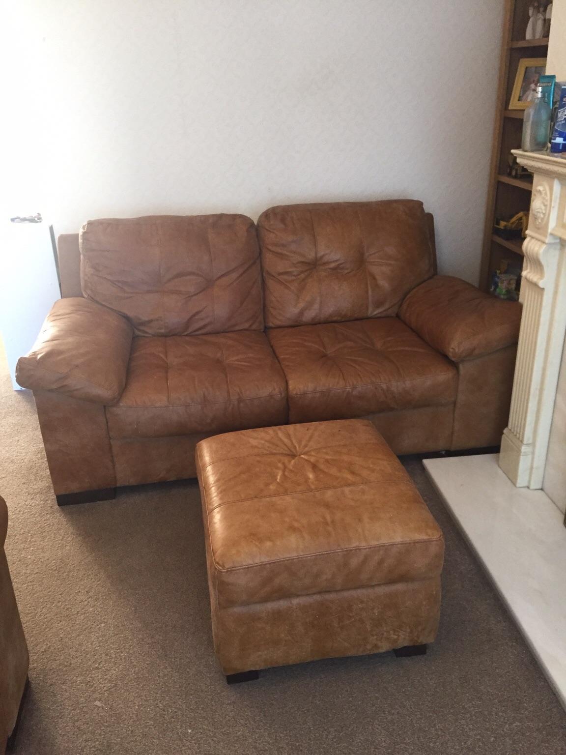 DFS tan leather 2 seater sofa and pouffe in DE4 Cromford for £175.00