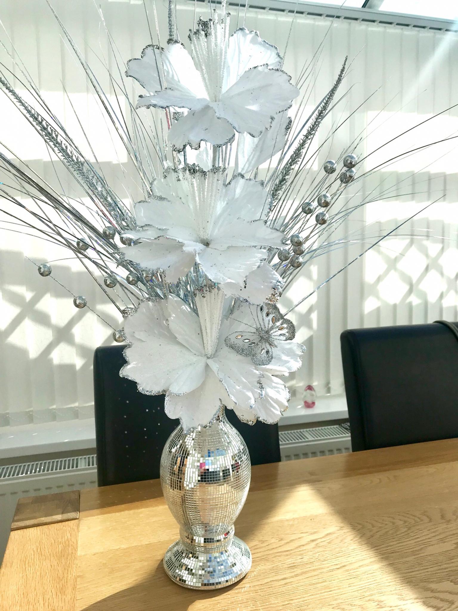White and silver flower arrangement in for £23.00 for sale Shpock