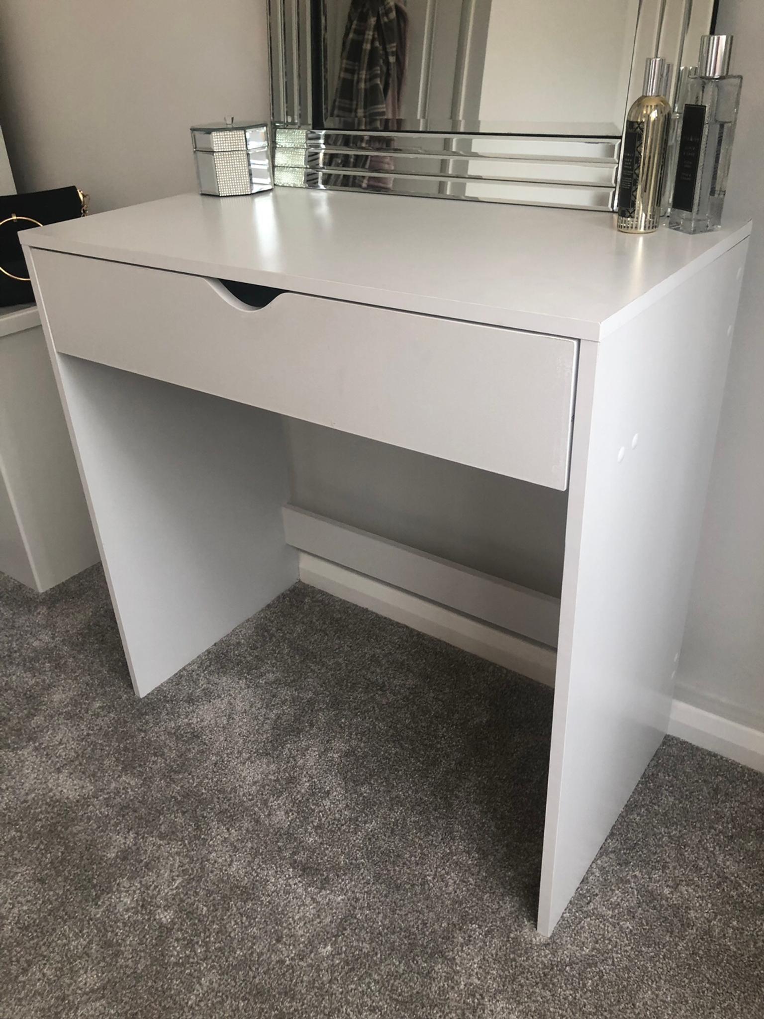 You dress while standing up or sitting in a chair. shpock