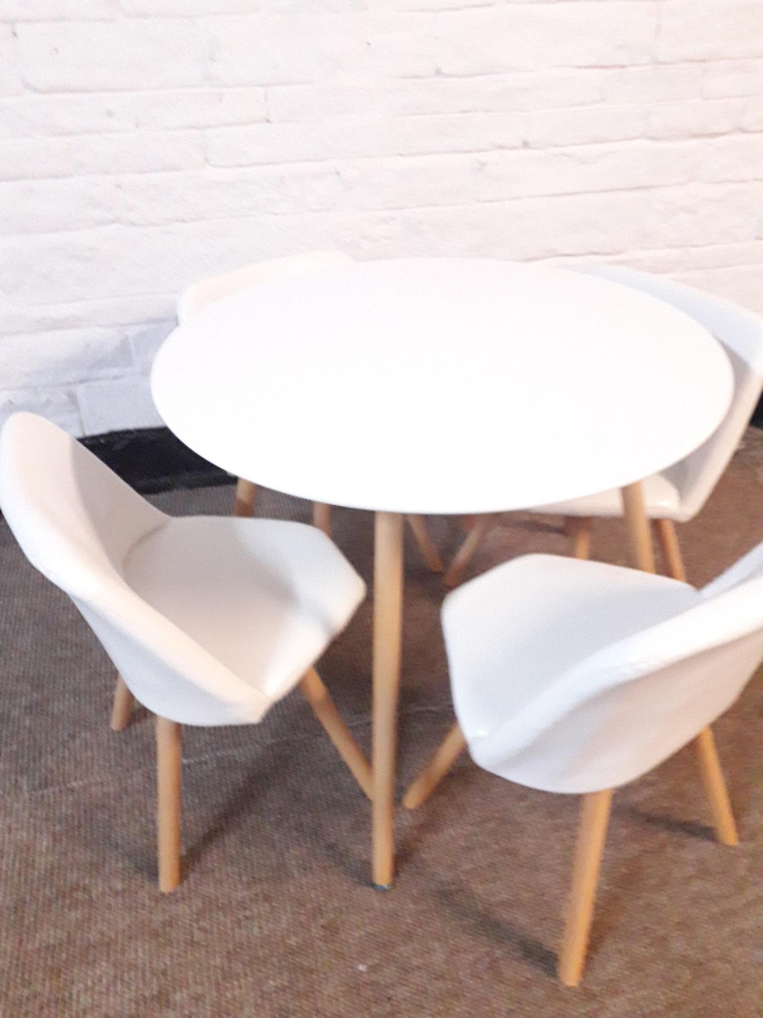 Round dining table and 4 chairs white in BD7 Bradford for £120.00 for