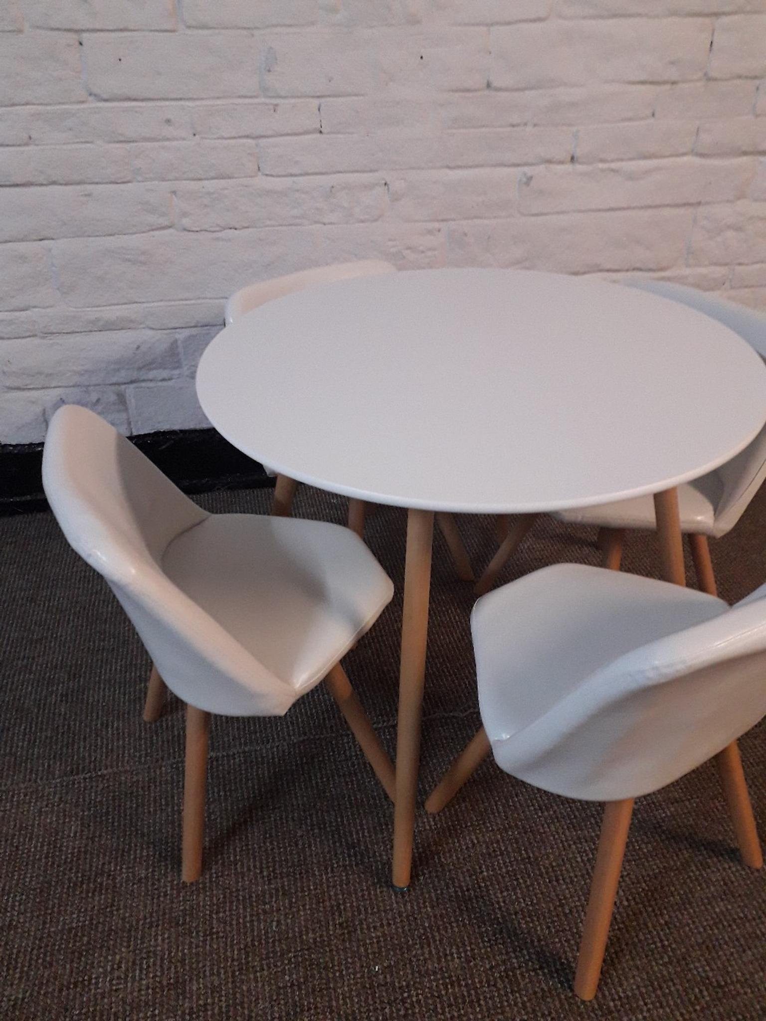 Round dining table and 4 chairs white in BD7 Bradford for £120.00 for
