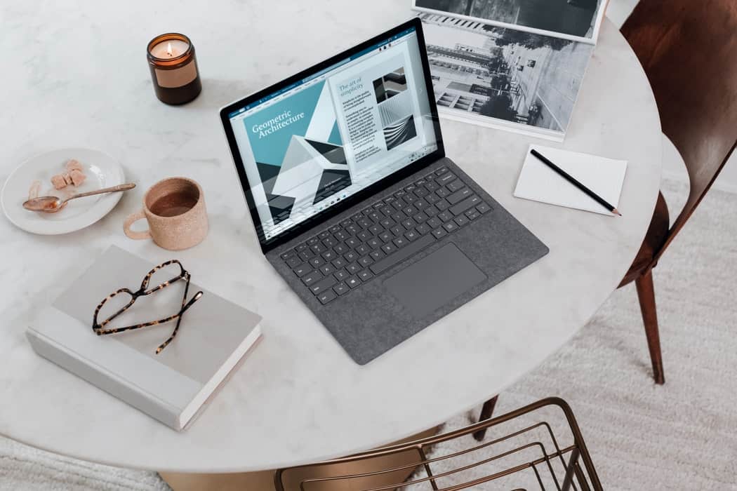 laptop and books on desk