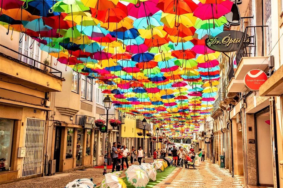 Colorful Umbrellas Float Above the Streets of Agueda, Portugal