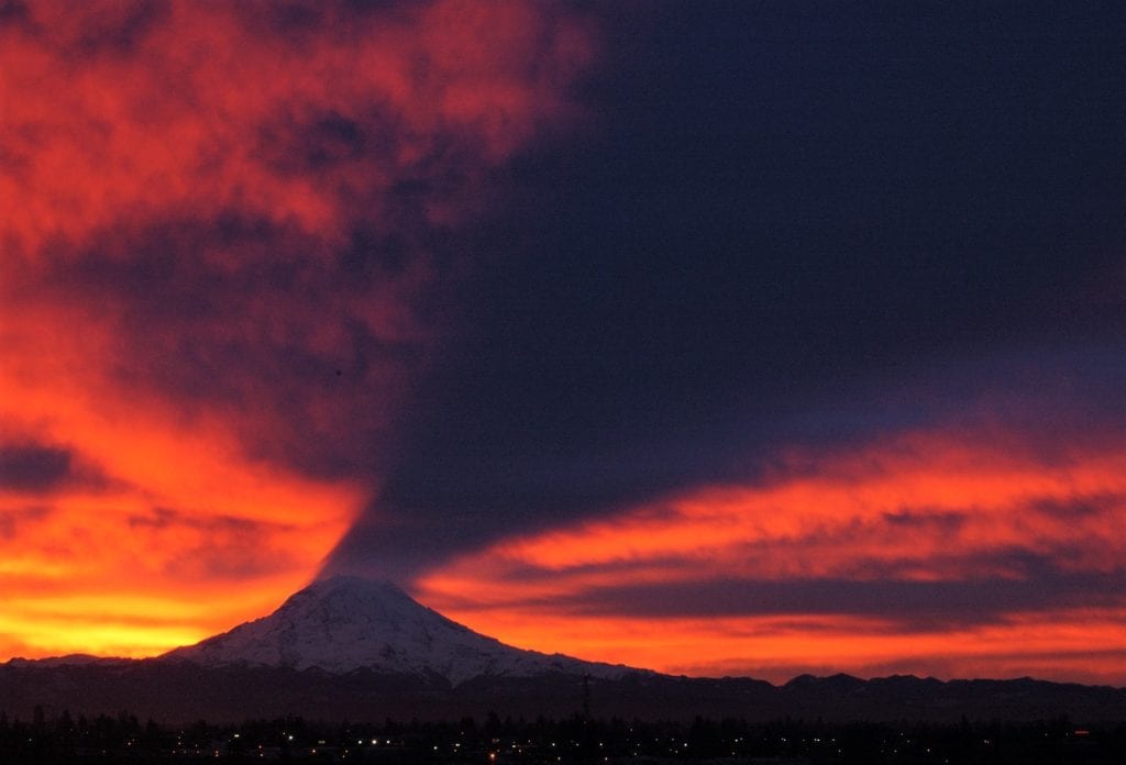 Mount Rainier, A Volcano That Casts Shadows In The Sky