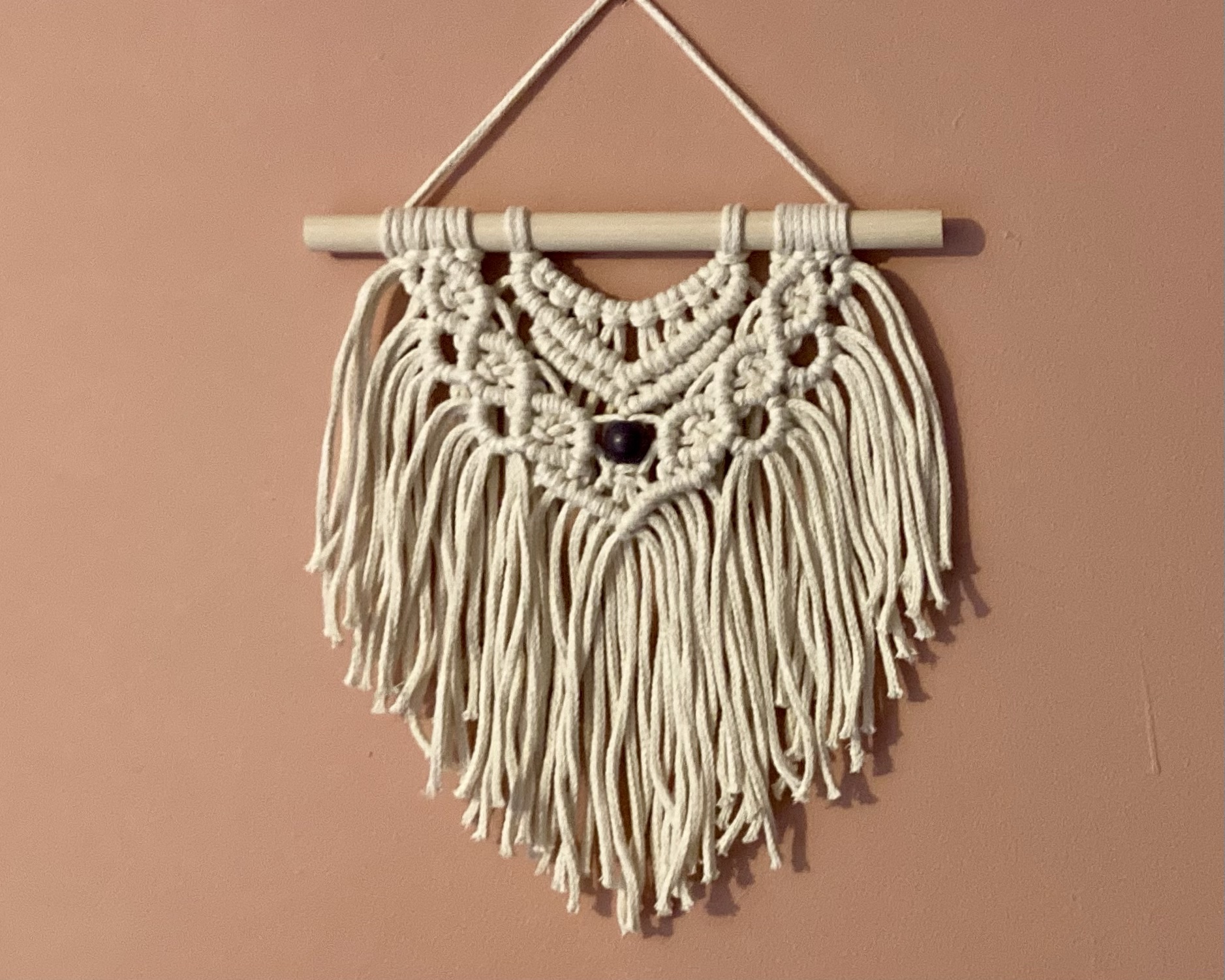 Handmade macrame wall hanging in ecru cotton braided cord