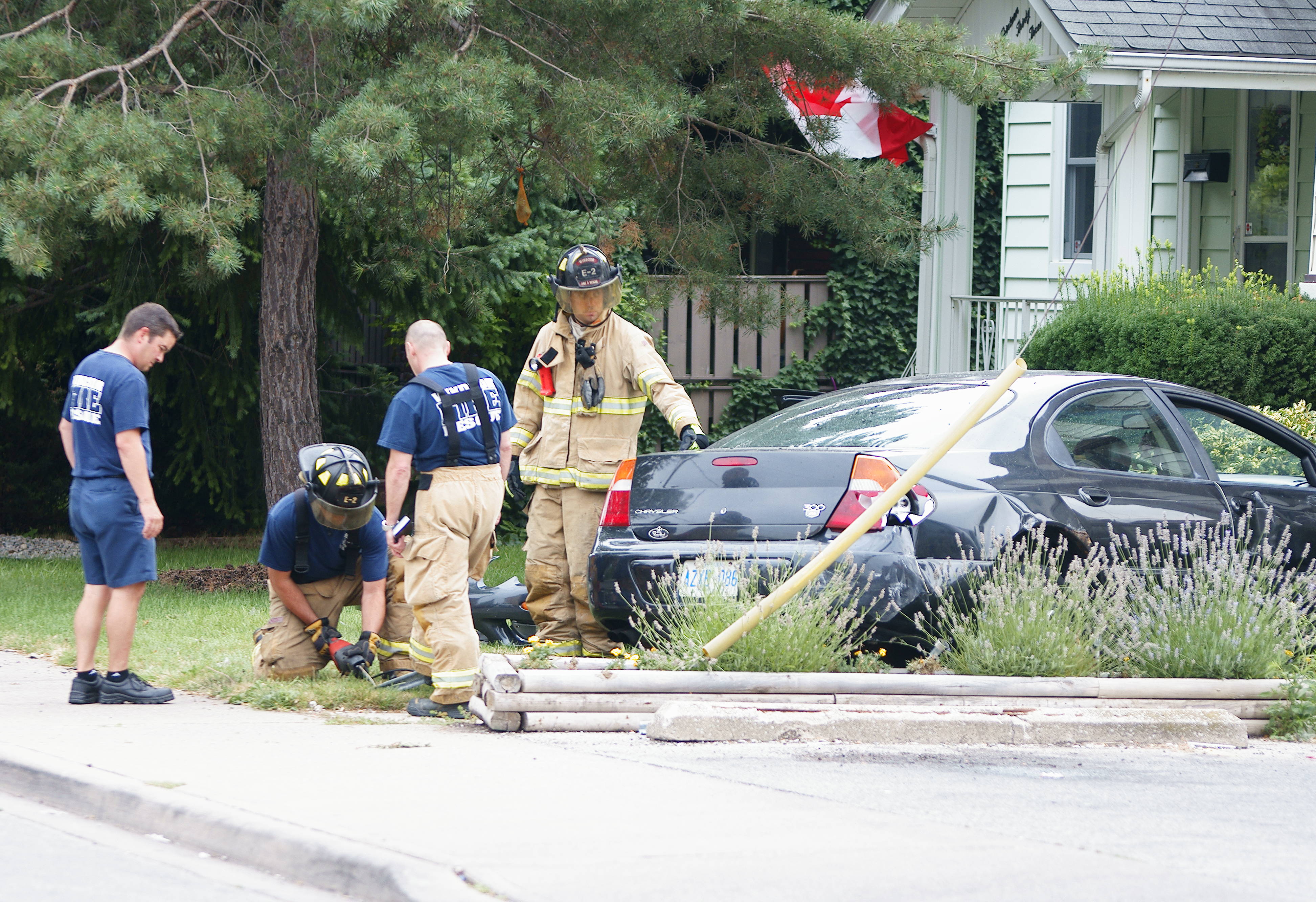 PHOTOS Accident at Ottawa and Moy Sends Car Onto Lawn