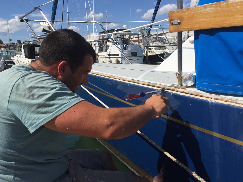 Boat Project Removing, rebedding and resealing the toerail and hull