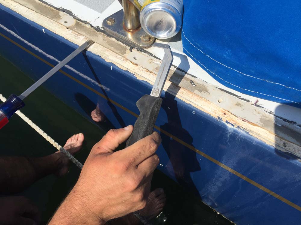 Boat Project Removing, rebedding and resealing the toerail and hull