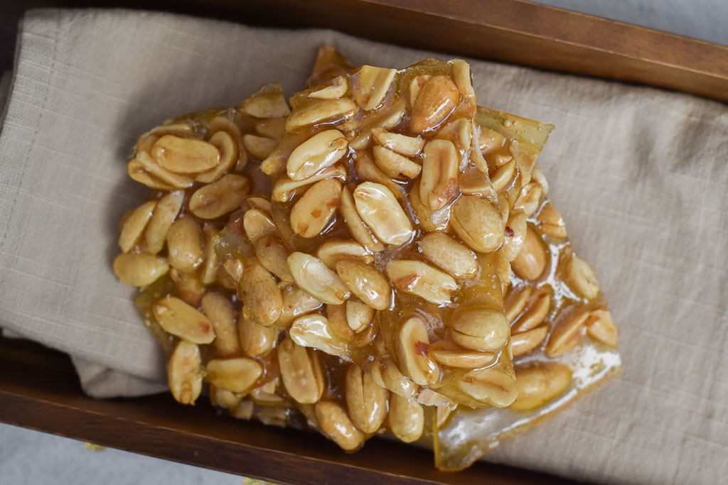 Salted Peanut Brittle with A Hint of Lime With Two Spoons