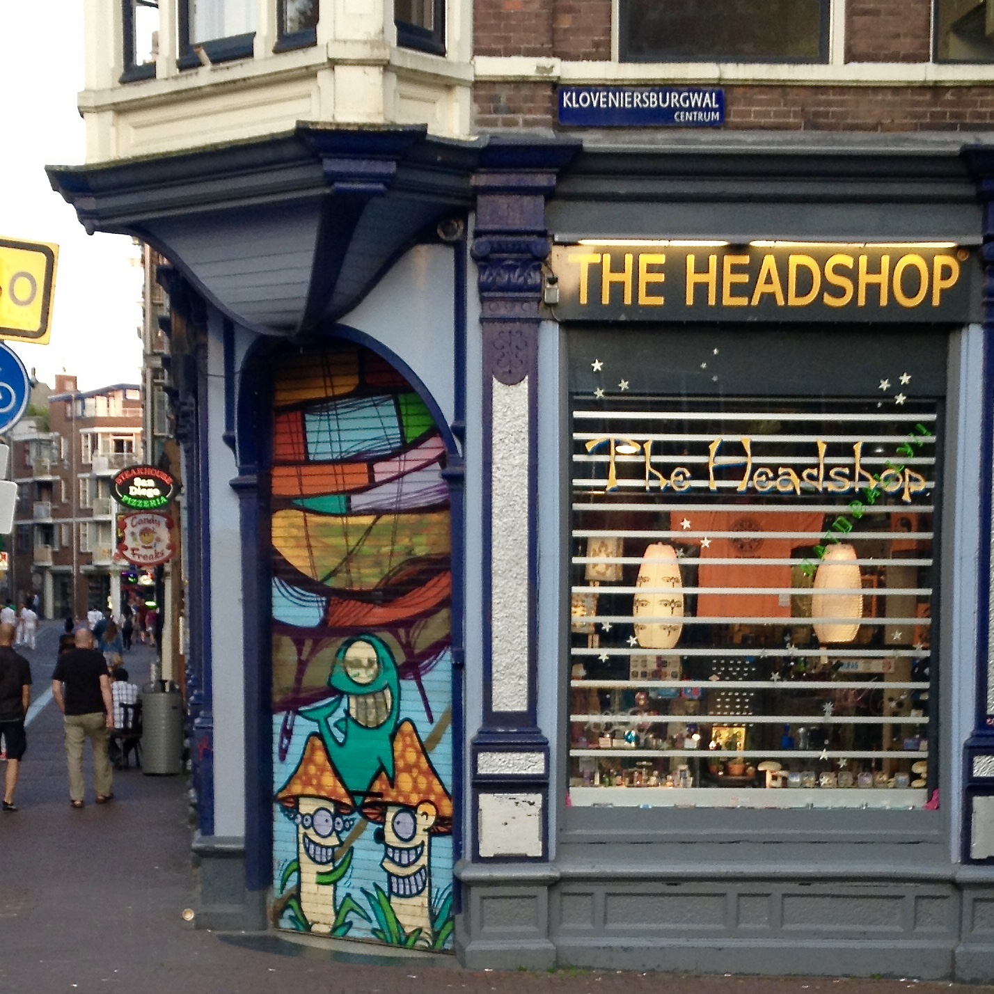 The Headshop: shark and mushrooms mural on a pulldown gate