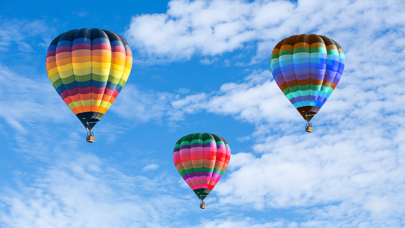 Colorful hot air balloons on the blue sky Wonders & Holidays