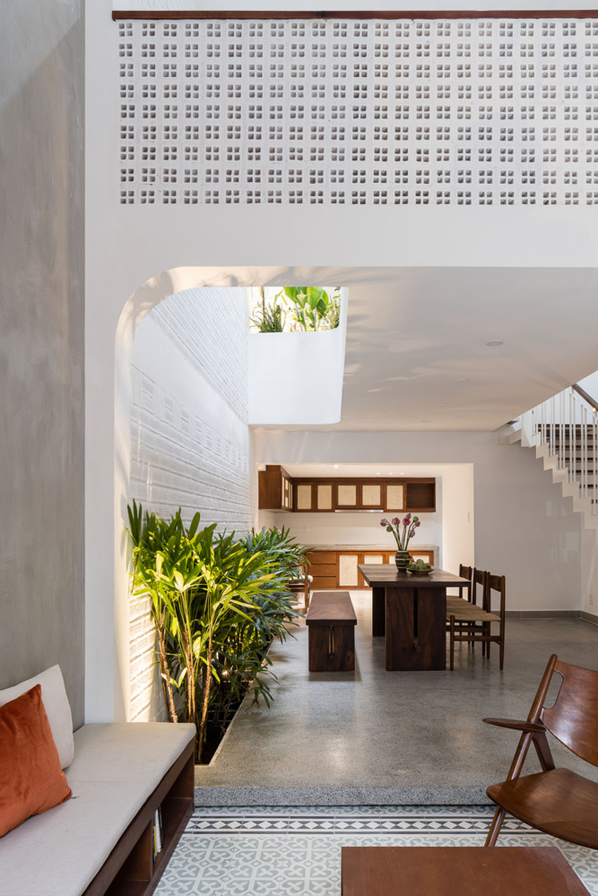 AD9 Architects adds small arches to old Vietnamese house to create