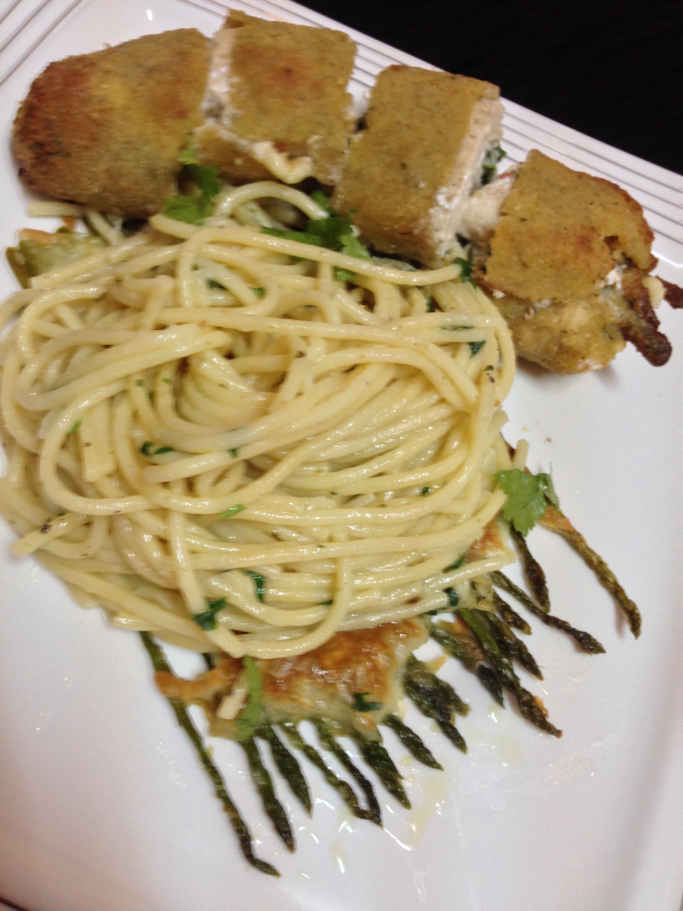 Chicken roulade served on grilled Asparagus and Spaghetti carbonara