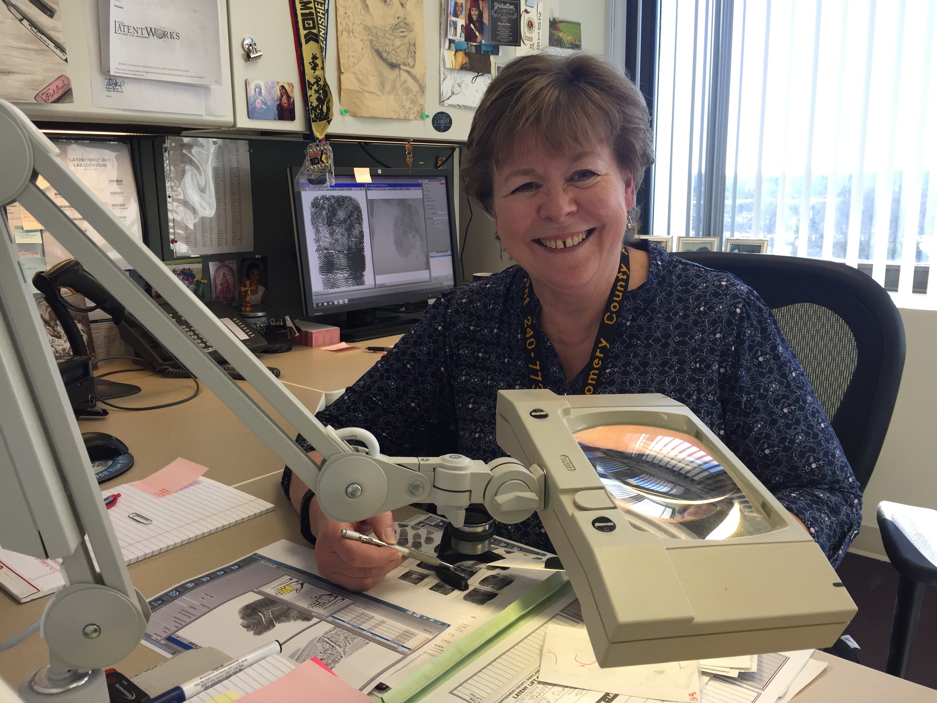 Fingerprint expert hangs up magnifying glass after decades of crime