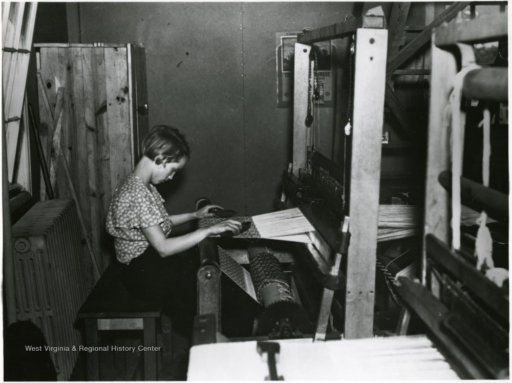 Child Weaving Using One of the Cooperative Looms at Reedsville, W. Va
