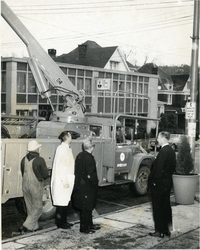 Utility Truck, Officials, and Workmen Across the Street from Hope