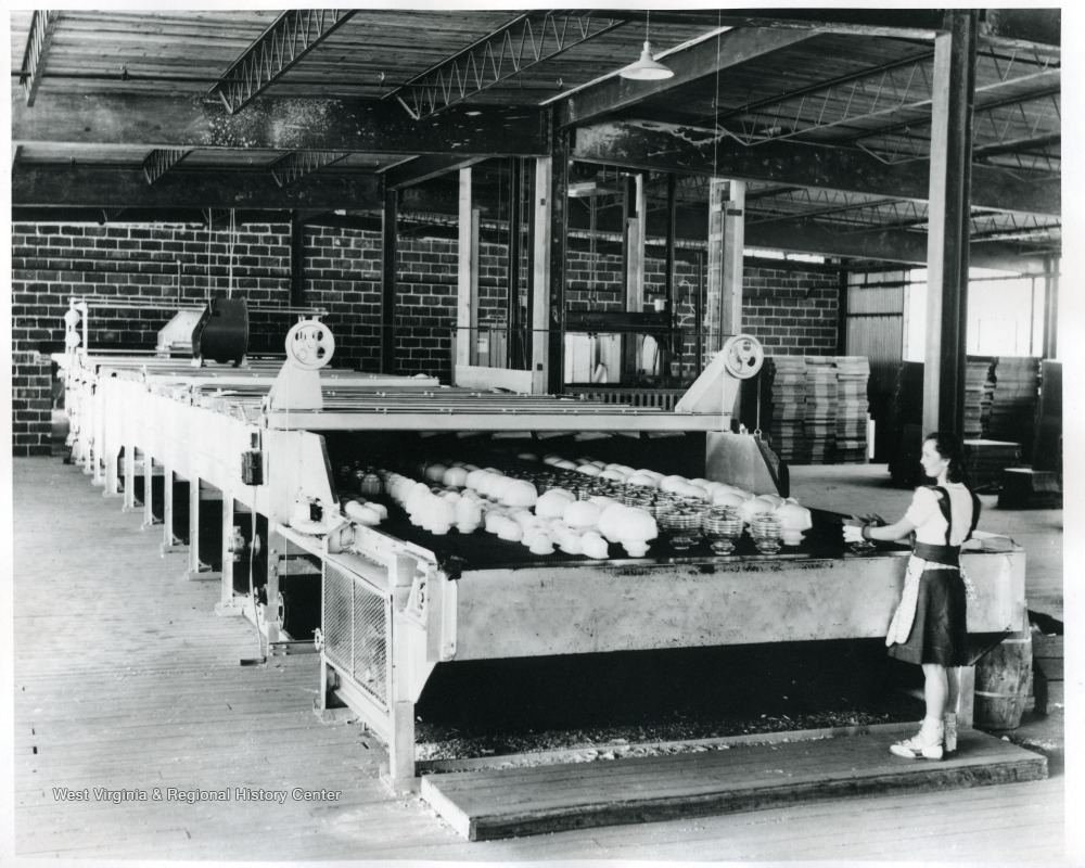 Glass Factory Employee Working with Various Glass Products,