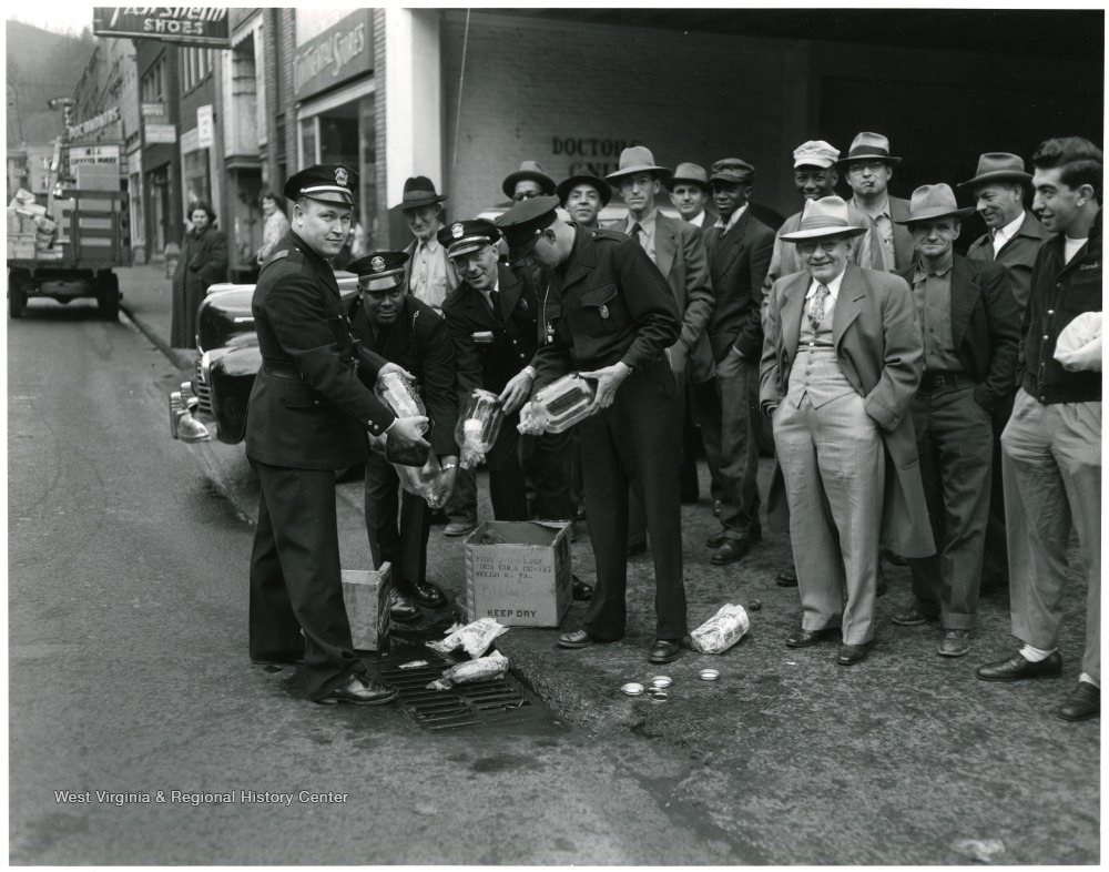 City Police Pouring Out Illegal Whiskey, Welch, W. Va. West Virginia History OnView WVU