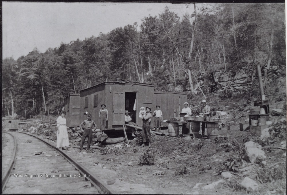 Logger Families in front of their Portable Homes at Three Forks of the