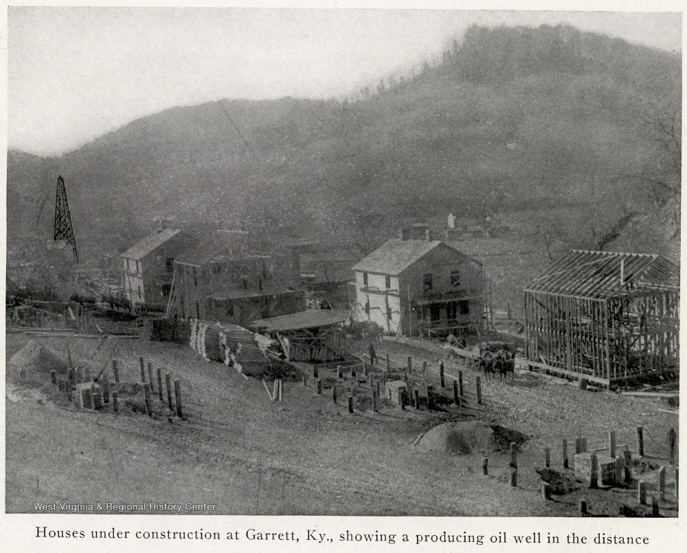 View of Houses Under Construction and a Producing Oil Well in the