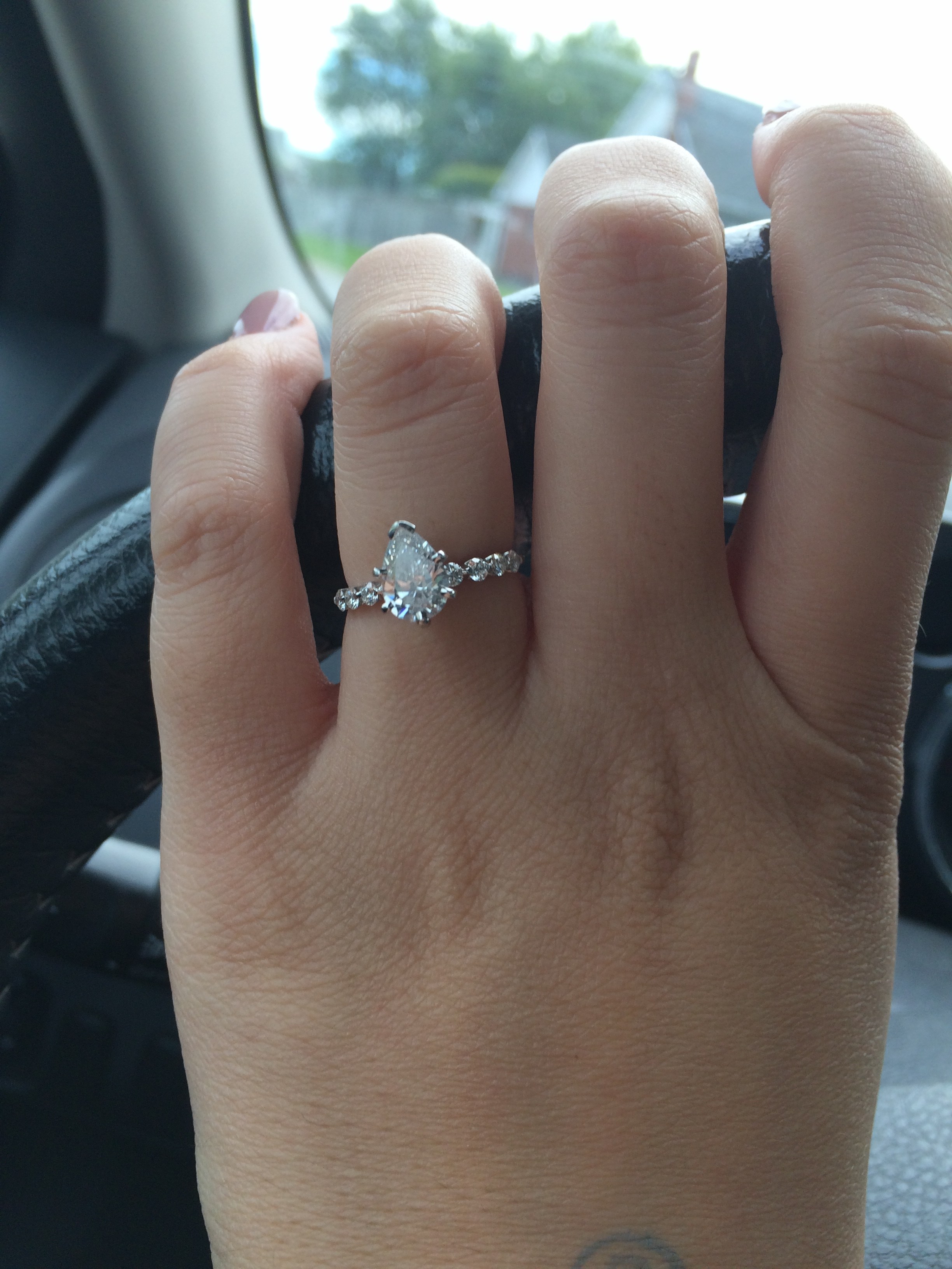 Can anyone show me photos of their pear shaped diamond (or other stone) Ring?!