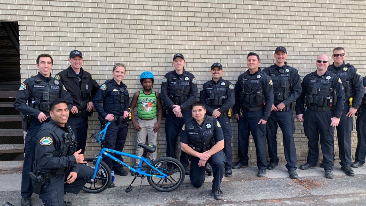 Provo police officers surprise young boy with new bicycle