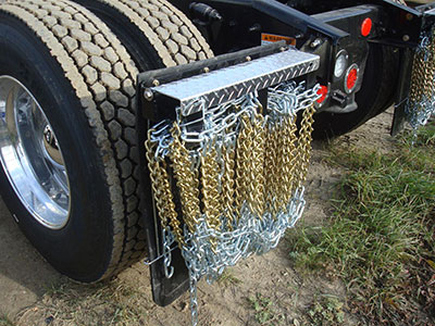 ELI5: Why do trucks have chains hanging below them? : explainlikeimfive