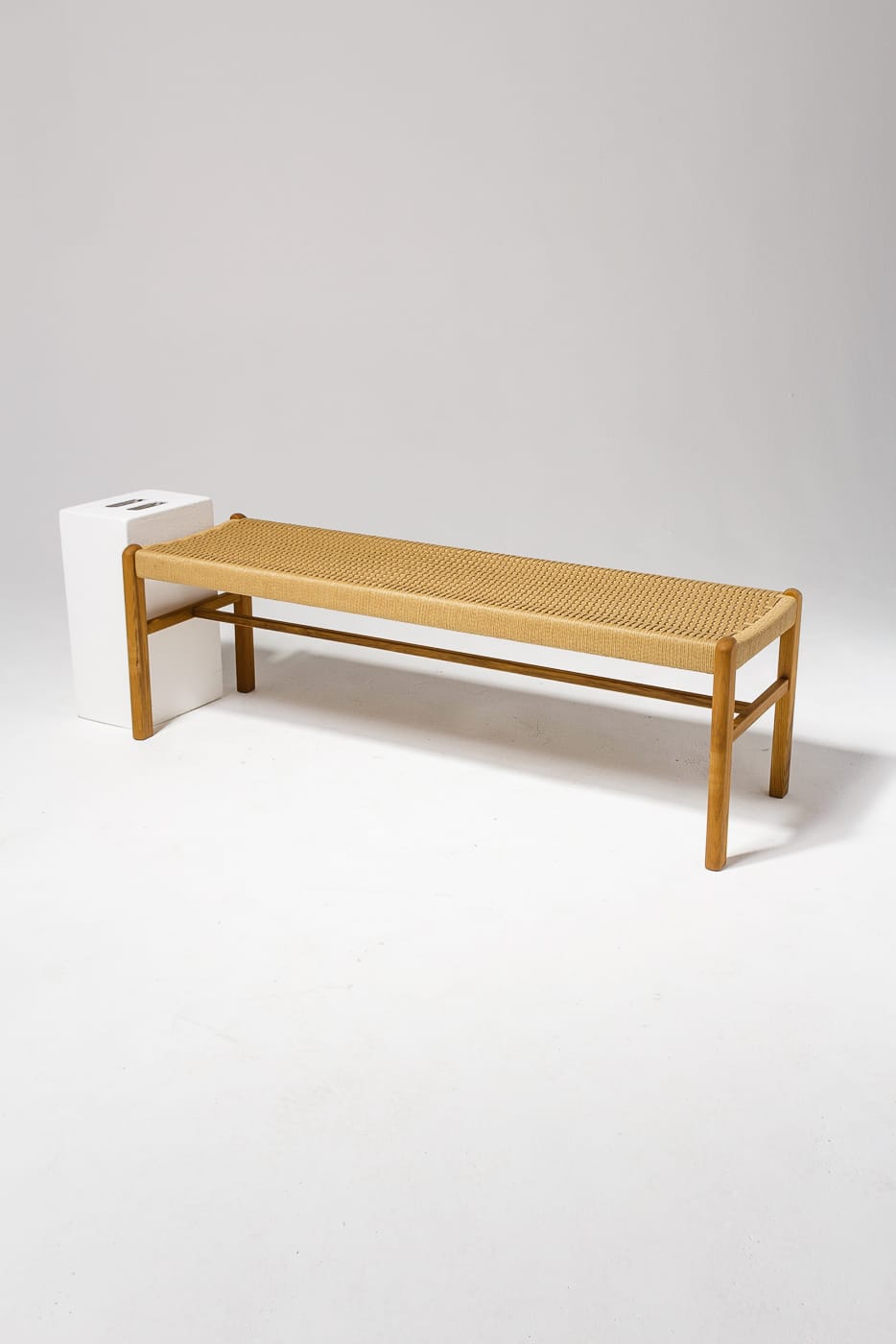 AB057 Chester Woven Rattan Bench Prop Rental ACME Brooklyn