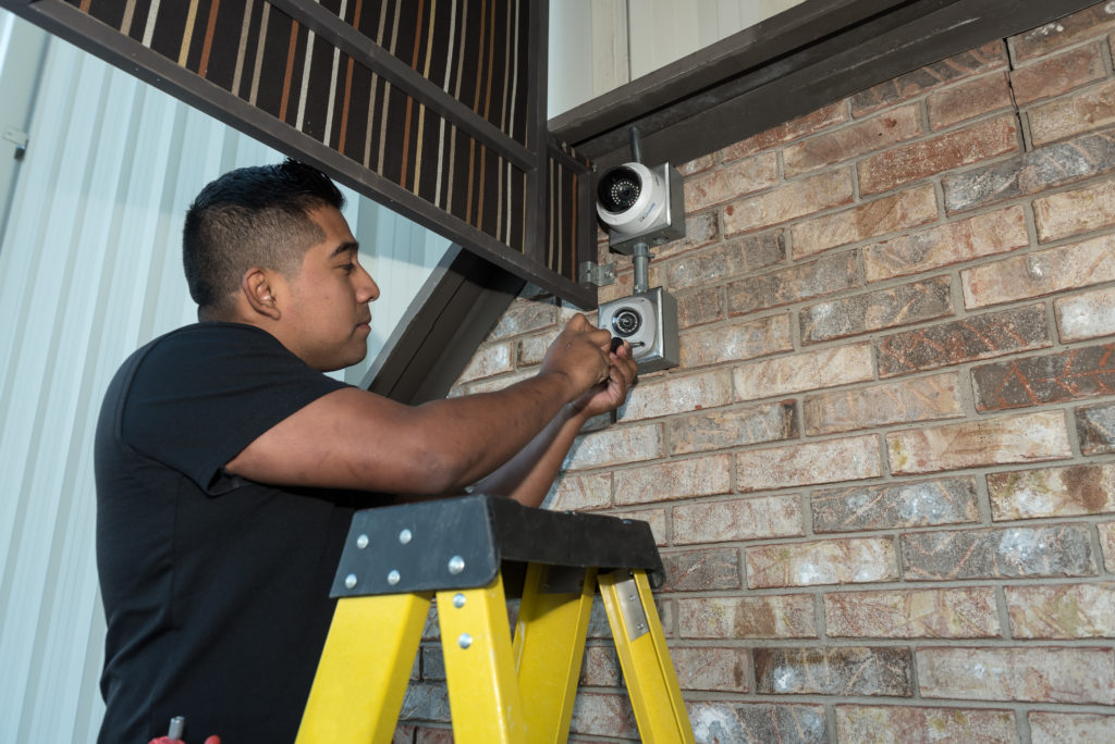 ACT Security tech team member working on video surveillance ACT