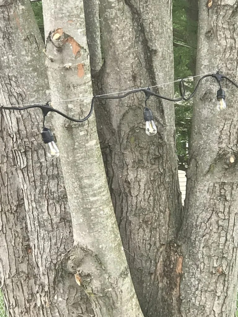 How to hang outdoor string lights Backyard DIY Ideas A Cup Full of Sass