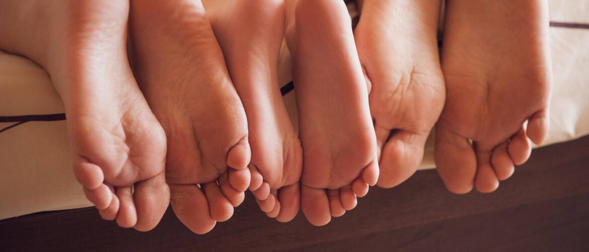 Soles of feet on end of the bed Adelaide West Physio + Pilates