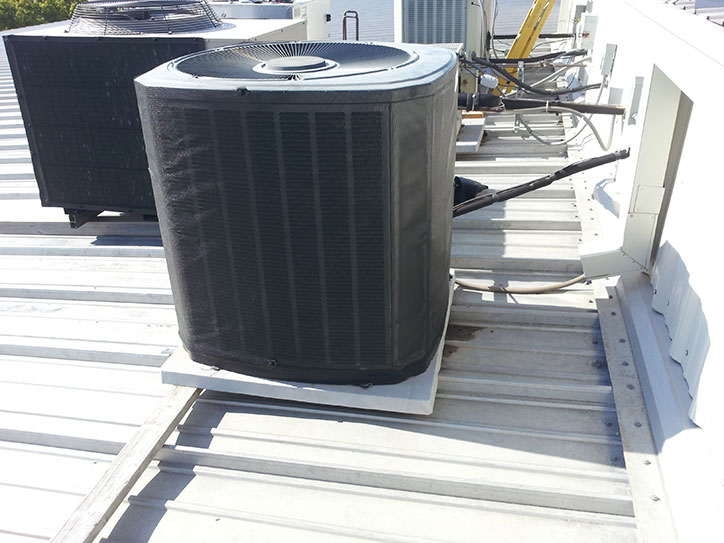 Rooftop Unit Filter Screen Over Steel Hail Guards. Air Solution Company