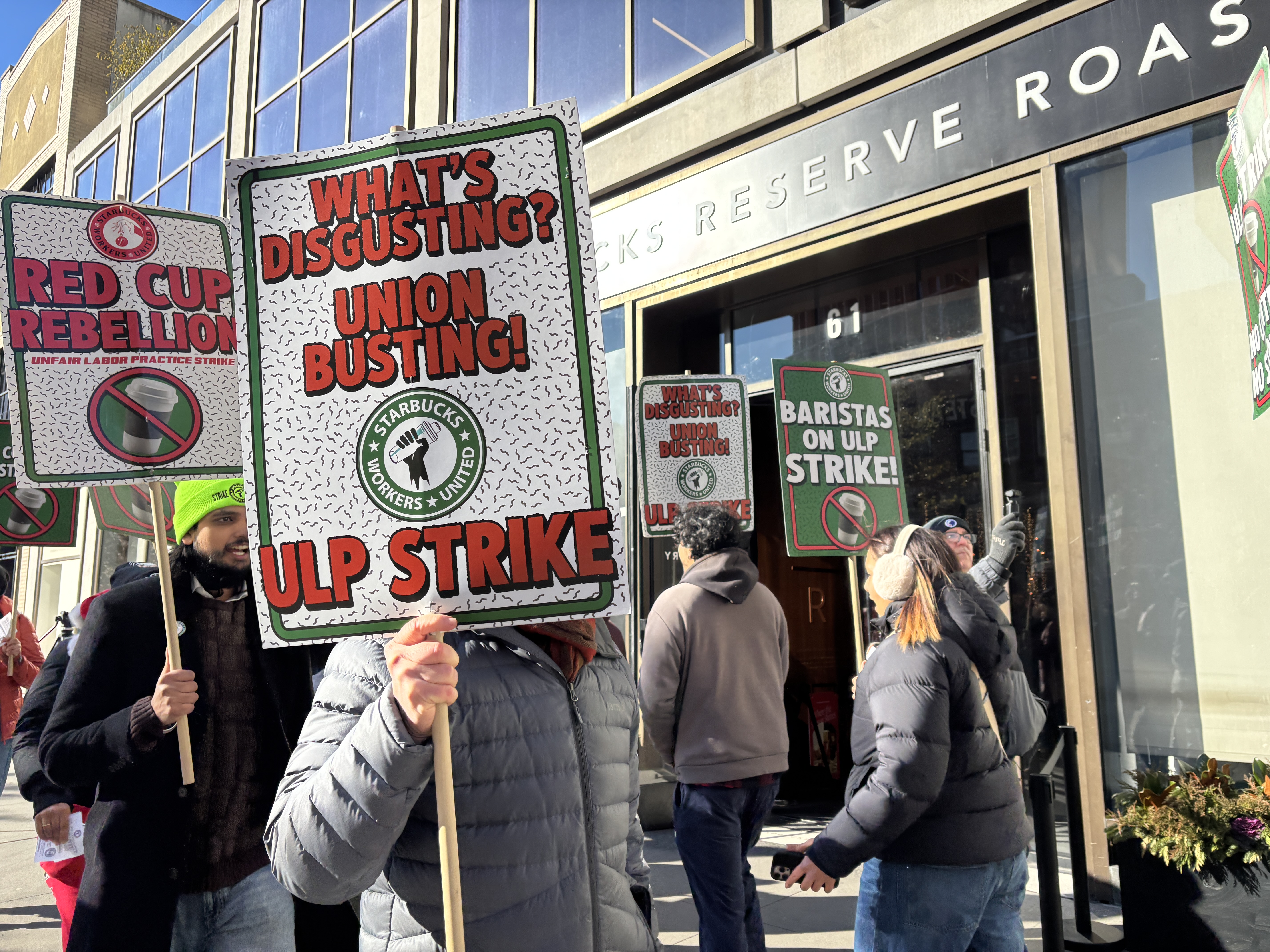Striking Starbucks baristas rally for contract