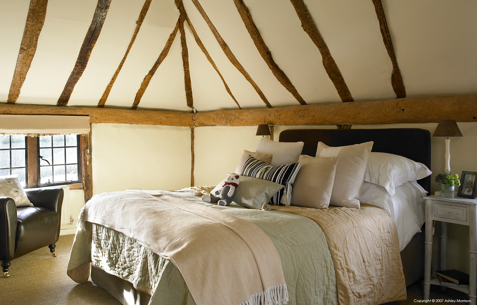 The master bedroom in Beth and Jason Cooper's 16thcentury Barn style