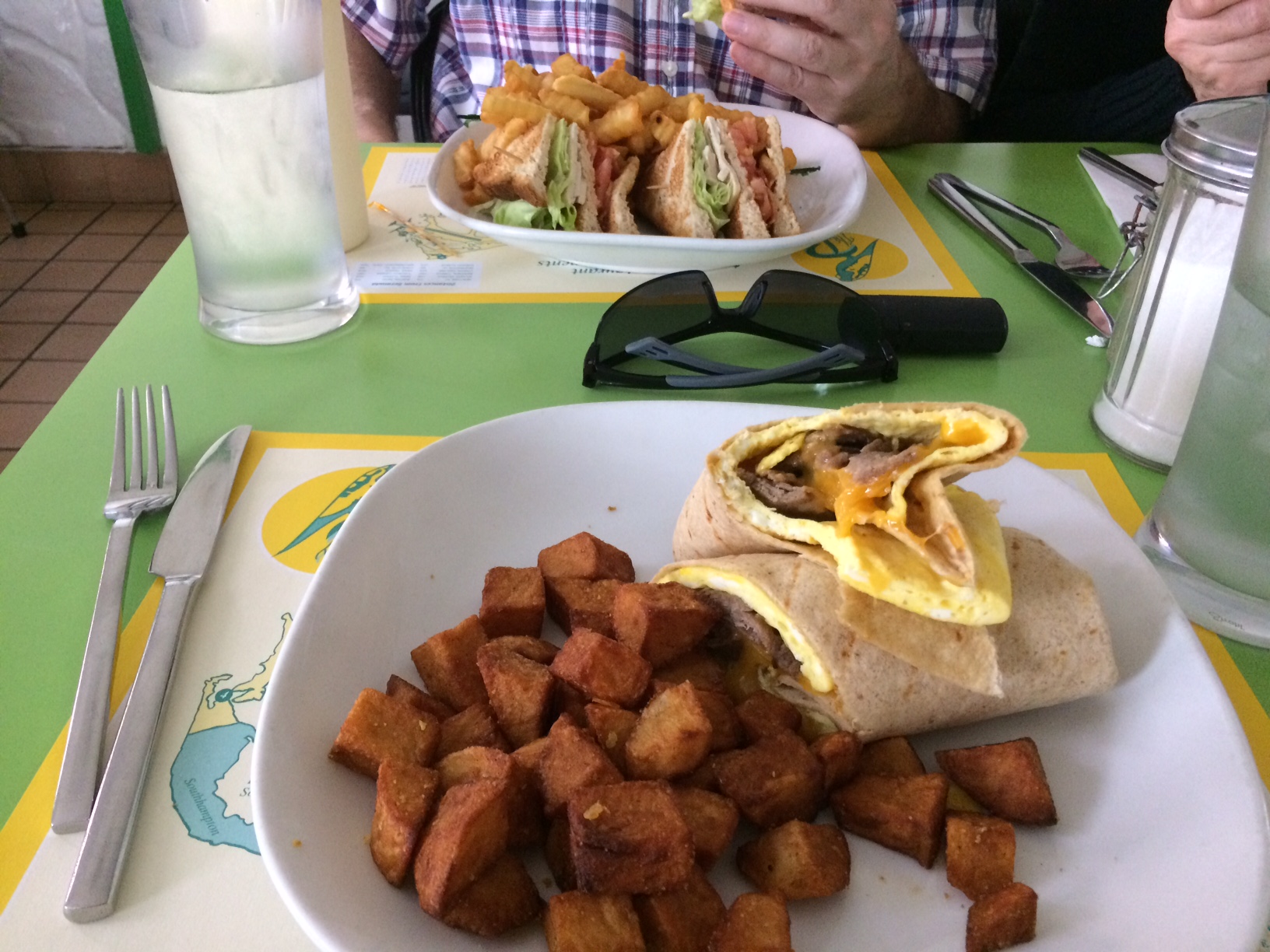 My steak and eggs Burrito and adjacent club sandwich at Parakeet