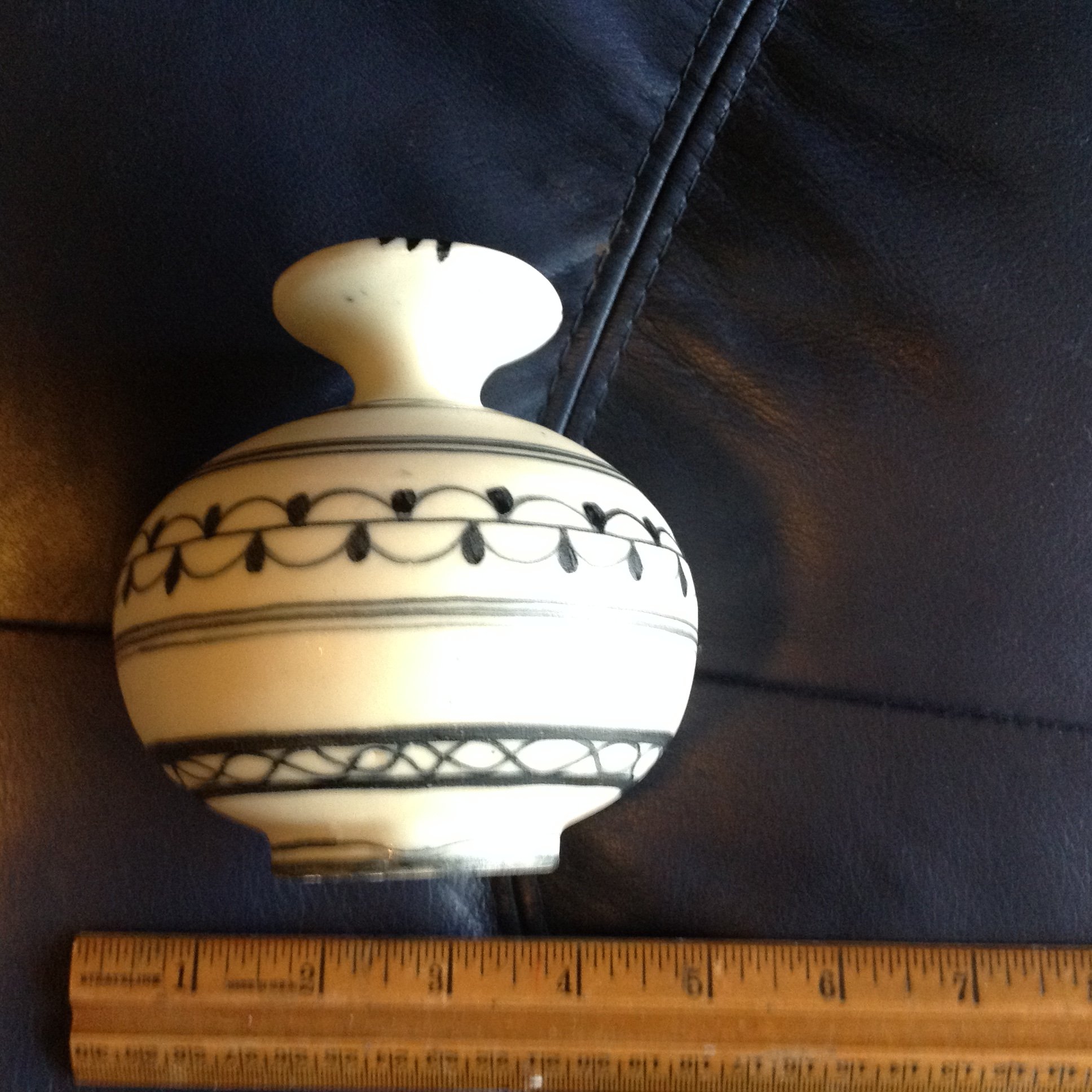 Small black and white pottery vase Antiques Board