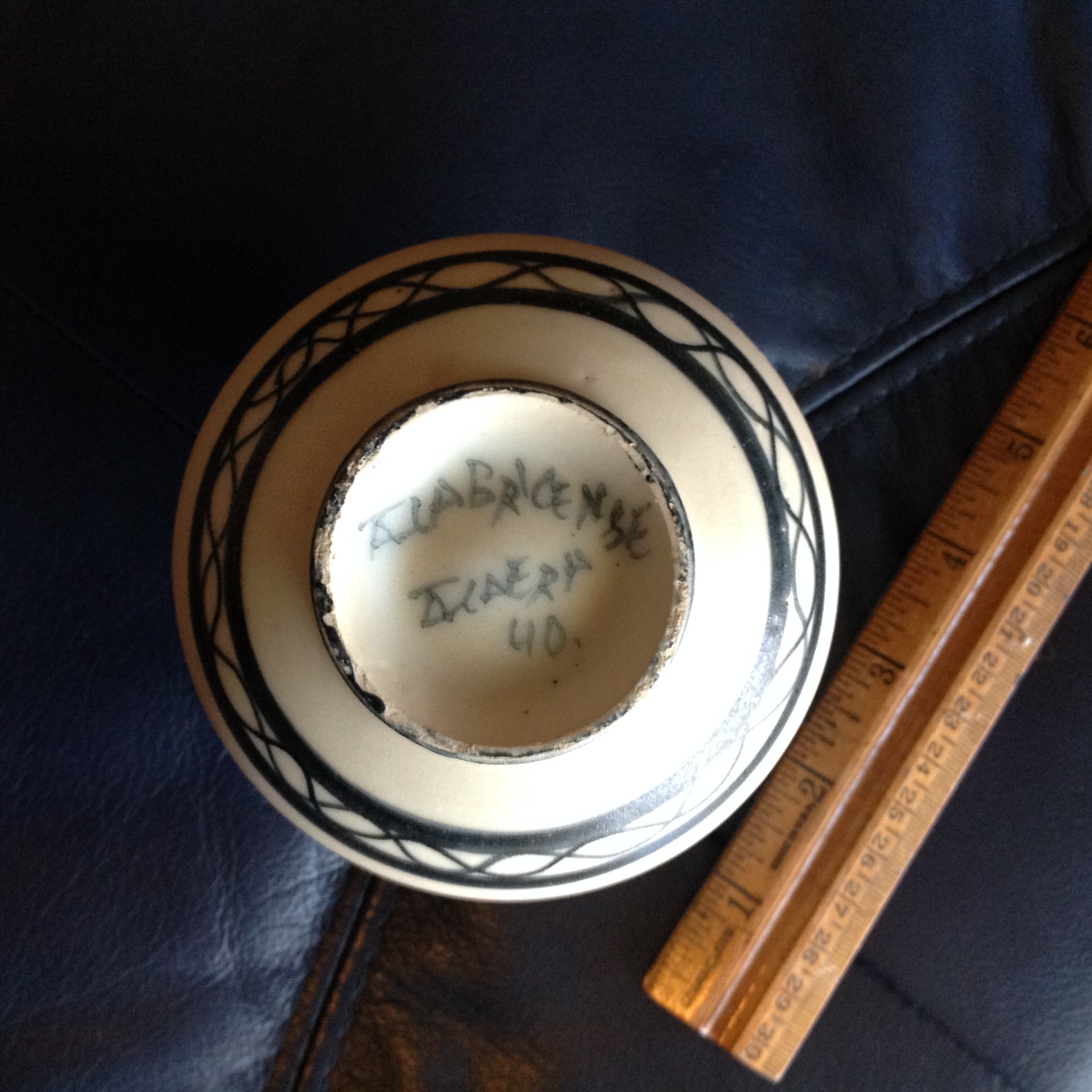 Small black and white pottery vase Antiques Board