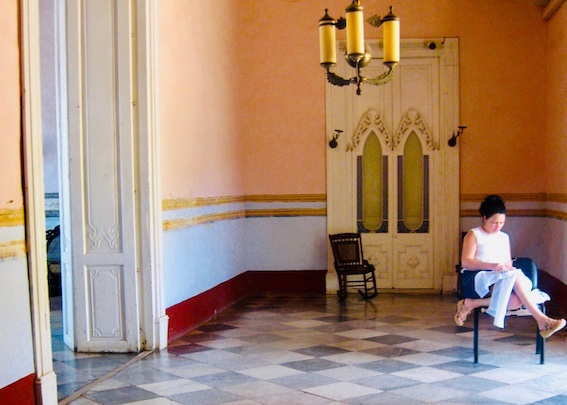 elegant room Cuba woman sewing