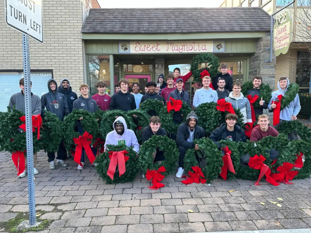 Arcadia’s Men’s Soccer Team “Decks the Halls” of Downtown Glenside
