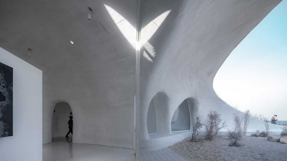 UCCA Dune Art Museum by OPEN ARCHITECTURE emerges as a hidden shelter
