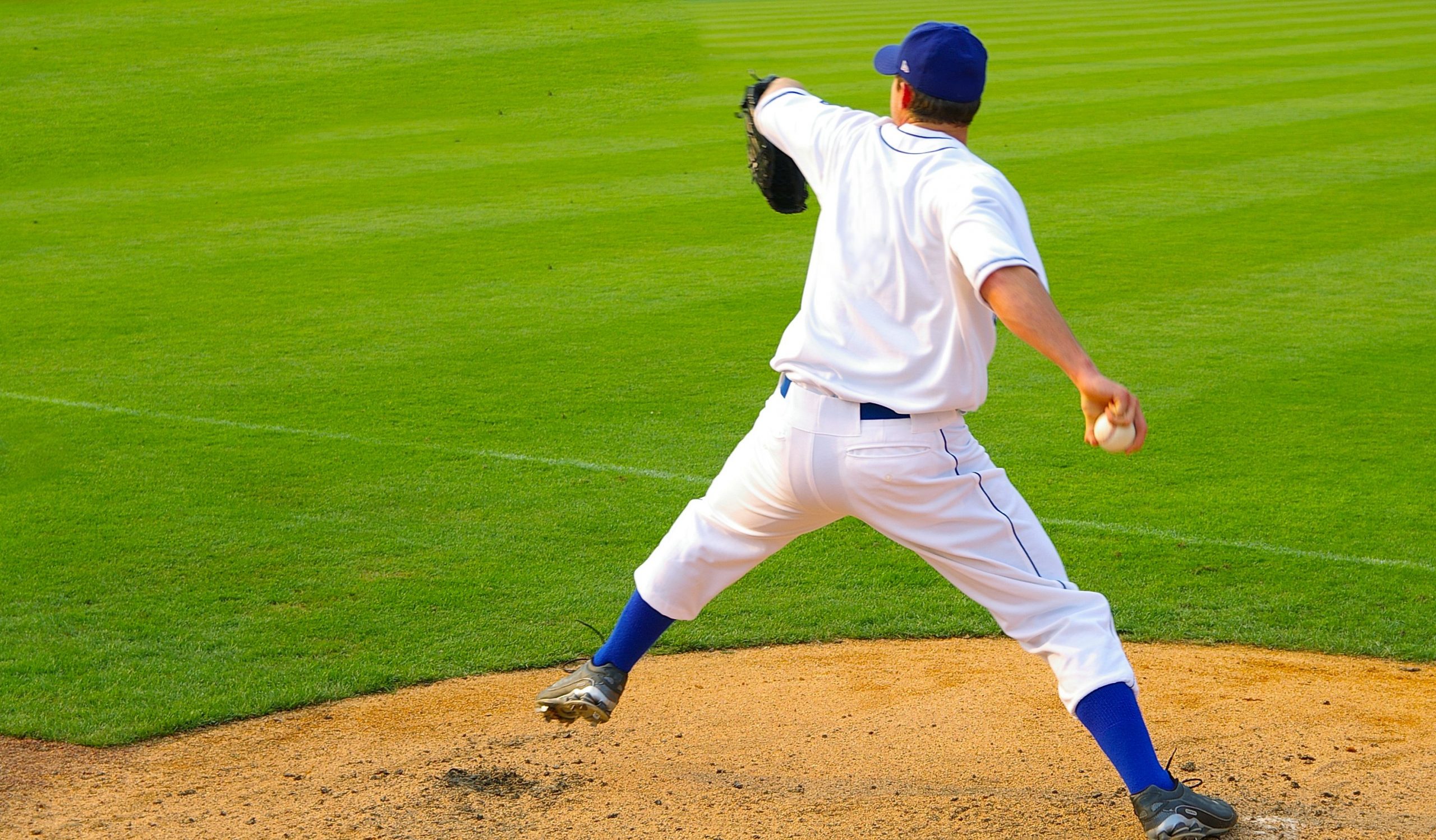 Professional baseball pitcher throwing the ball AOA Orthopedic