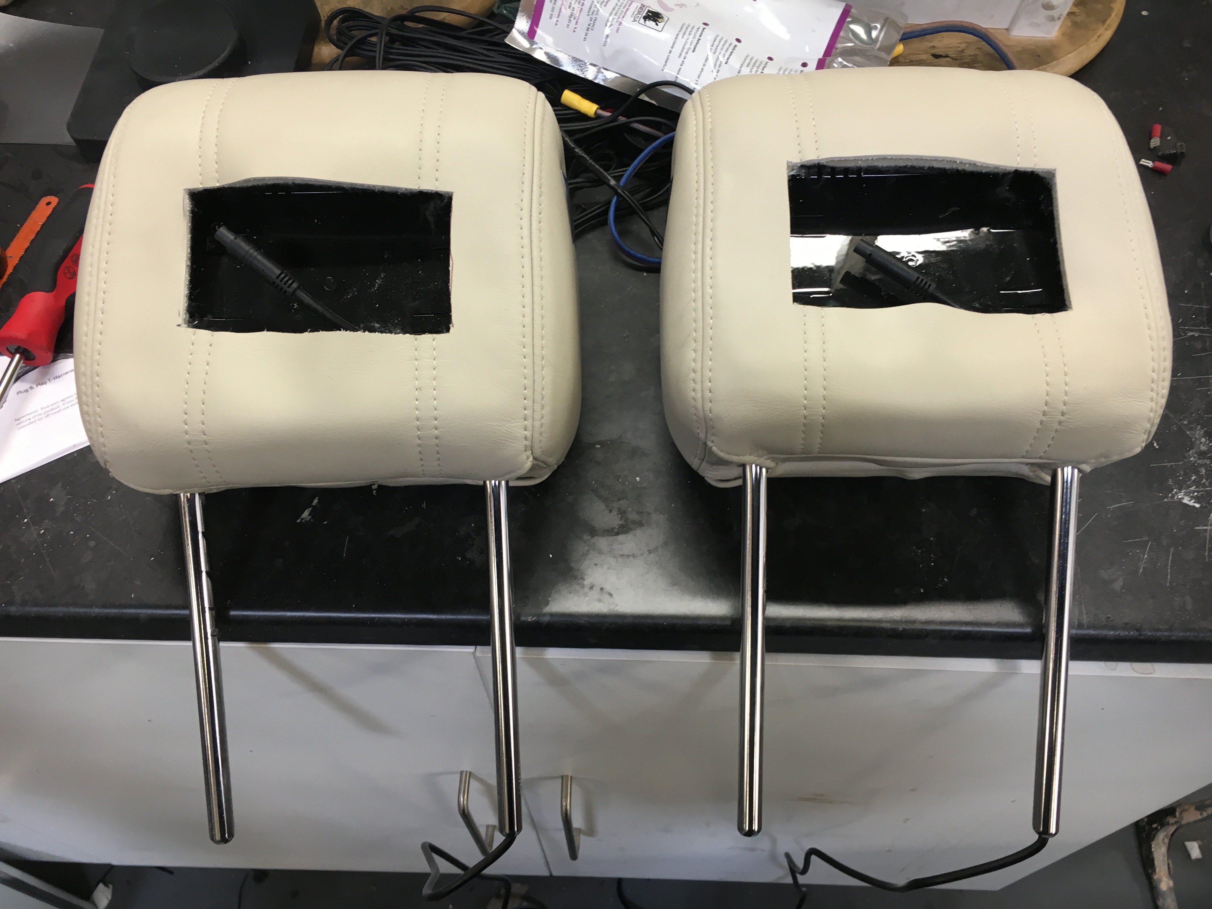 Headrest screen fitting Range Rover AV Solutions