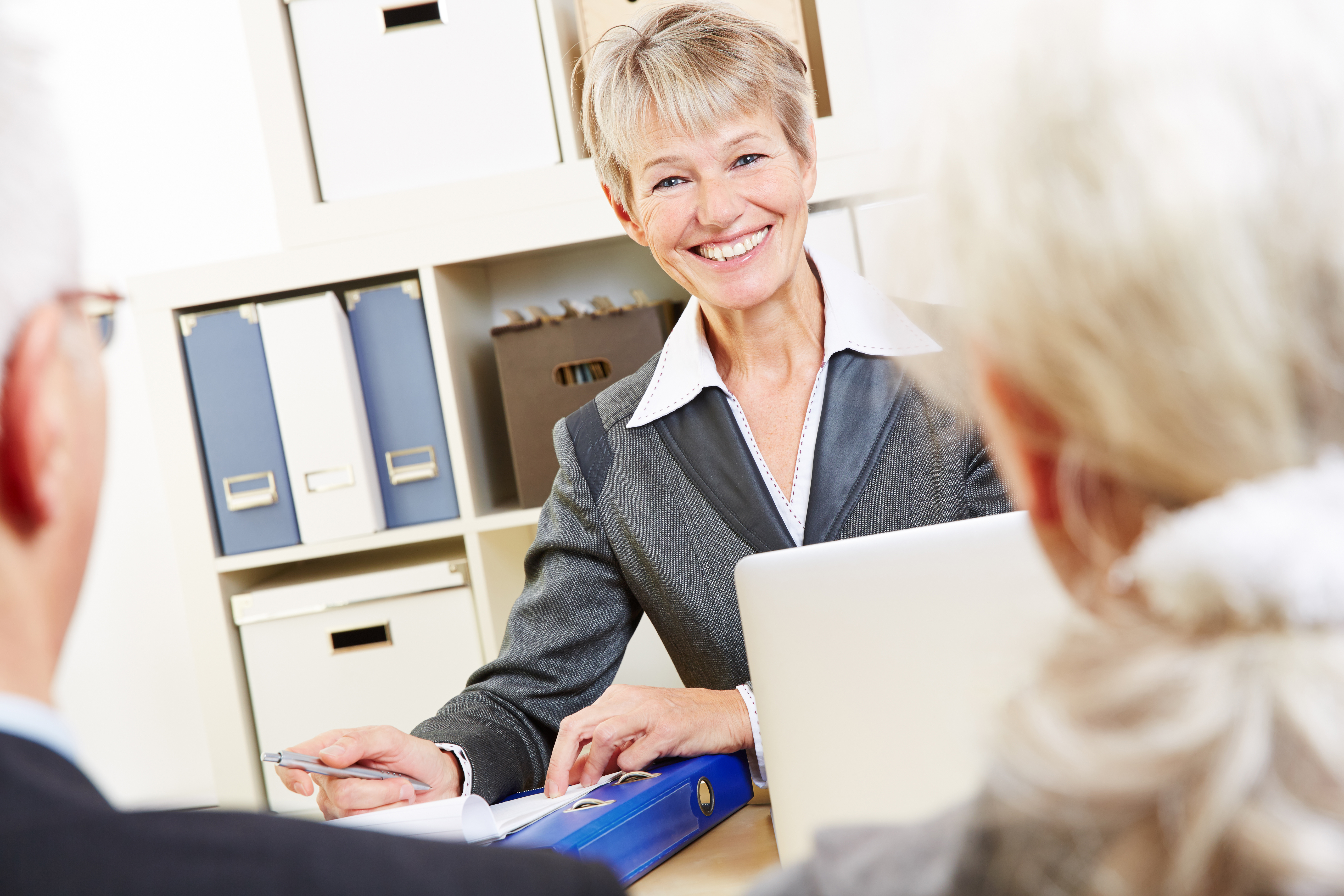 Consultant in bank giving financial advice BARE International