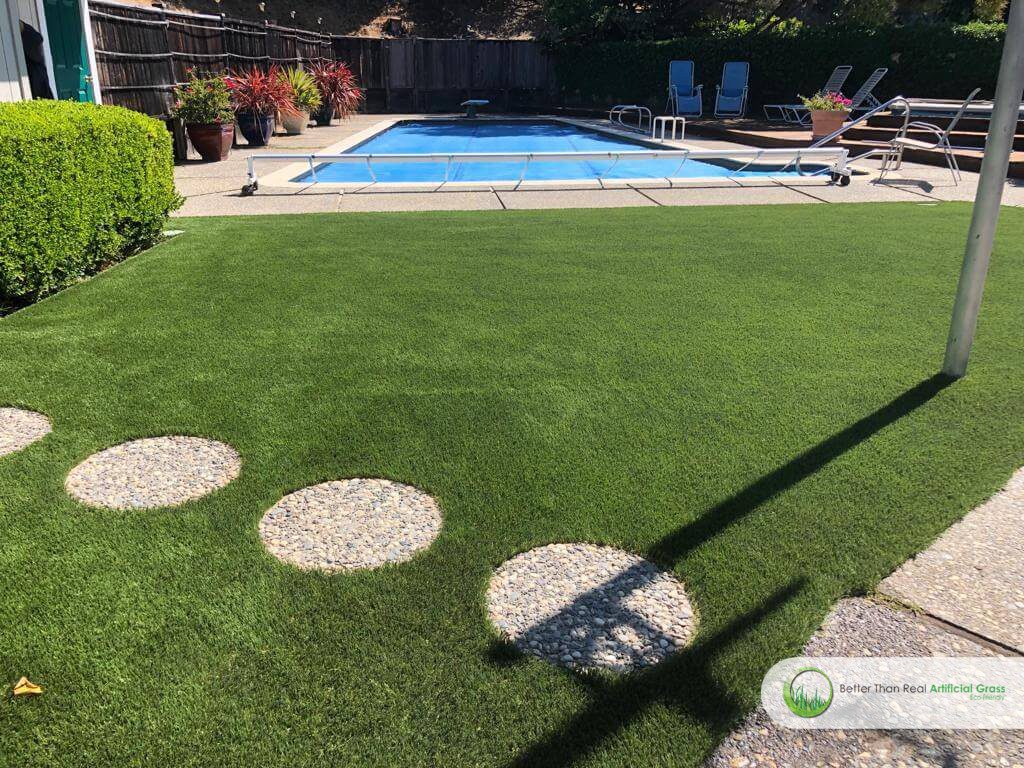 Artificial grass backyard around the pool in San Rafael, California