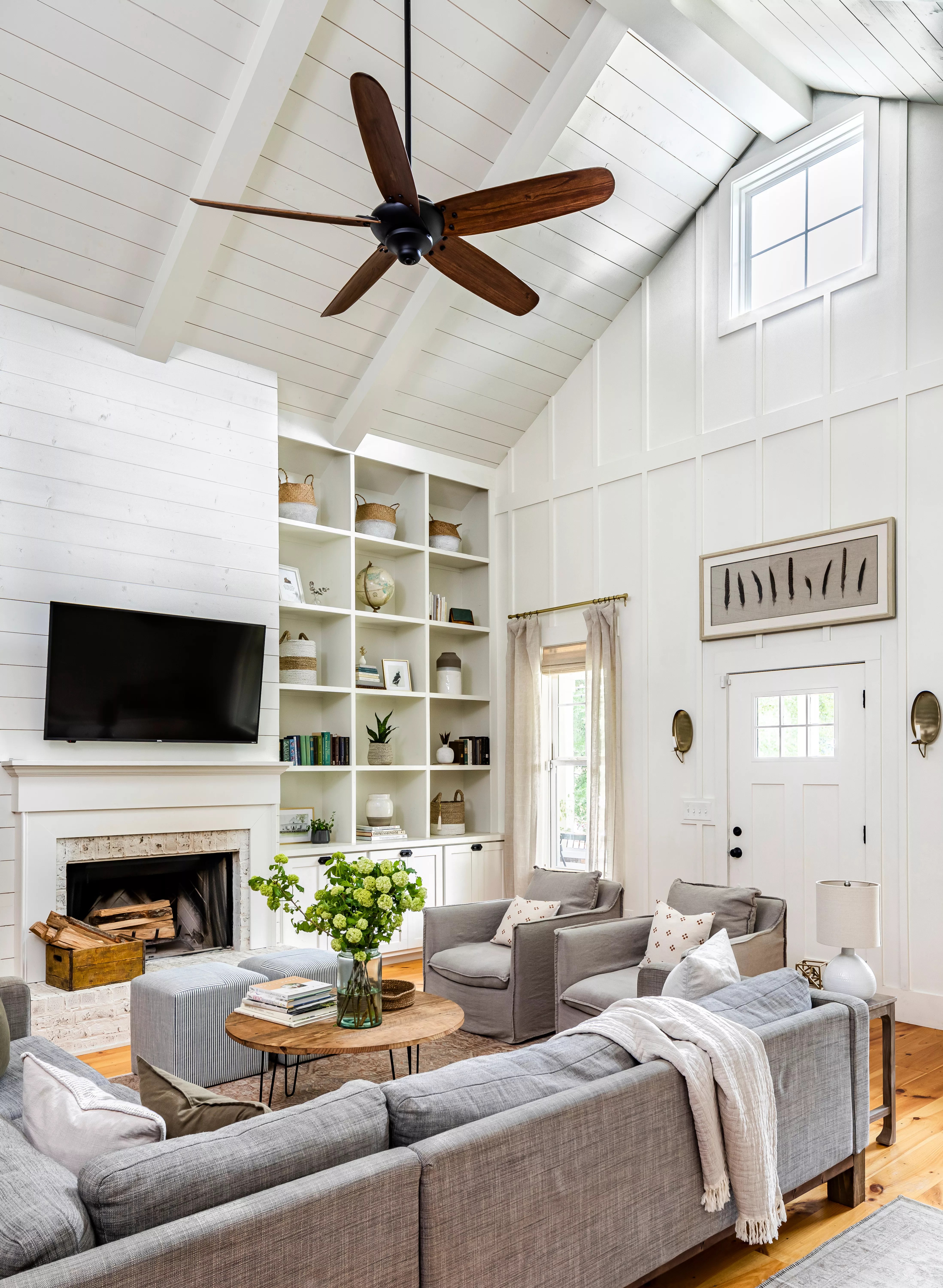 white living room with vaulted ceiling