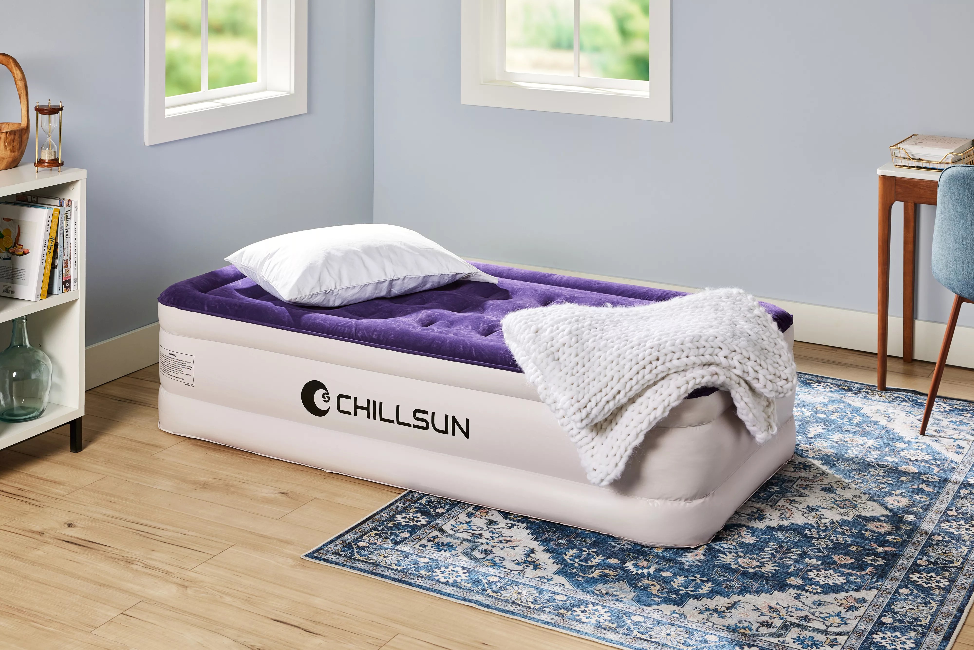 The Chillsun Twin Air Mattress fully inflated near a white bookcase